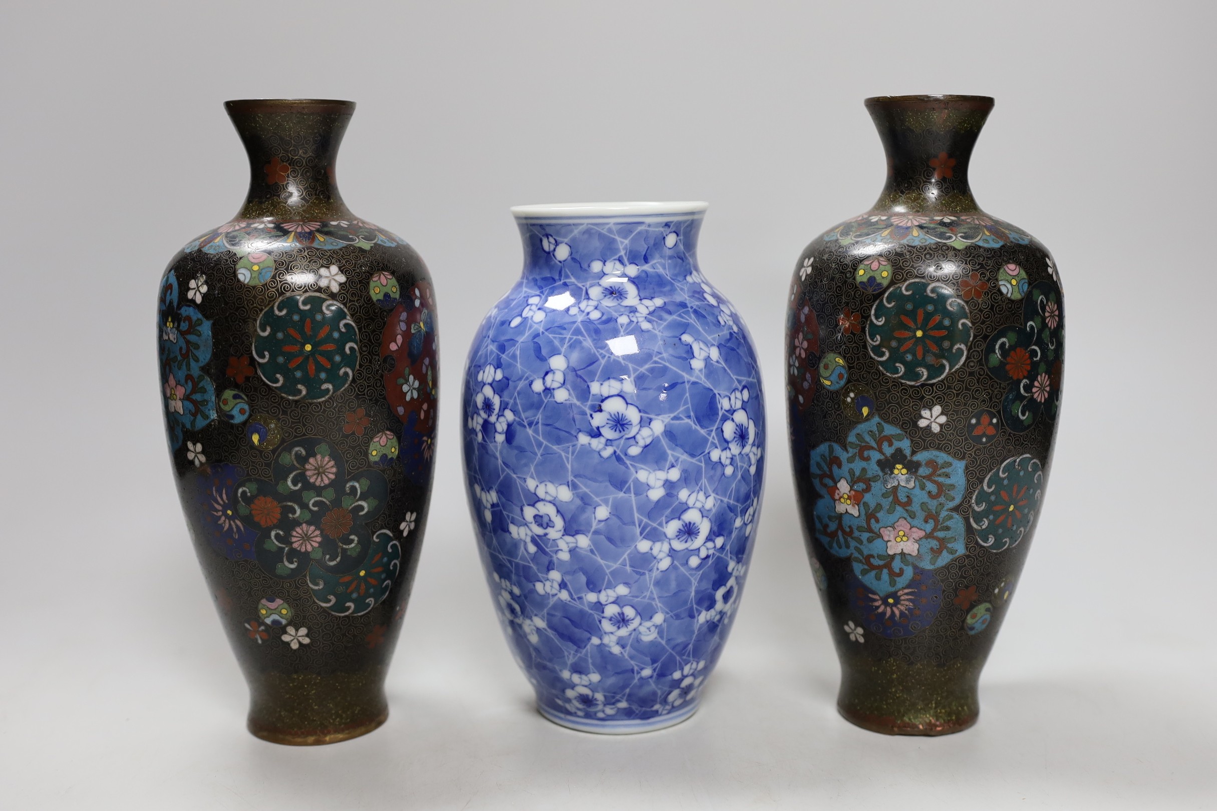 A pair of Japanese cloisonné enamel vases, four Japanese vases and an antimony dish. Tallest 22cm